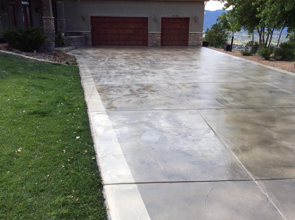 Grey acid wash driveway with mountain view