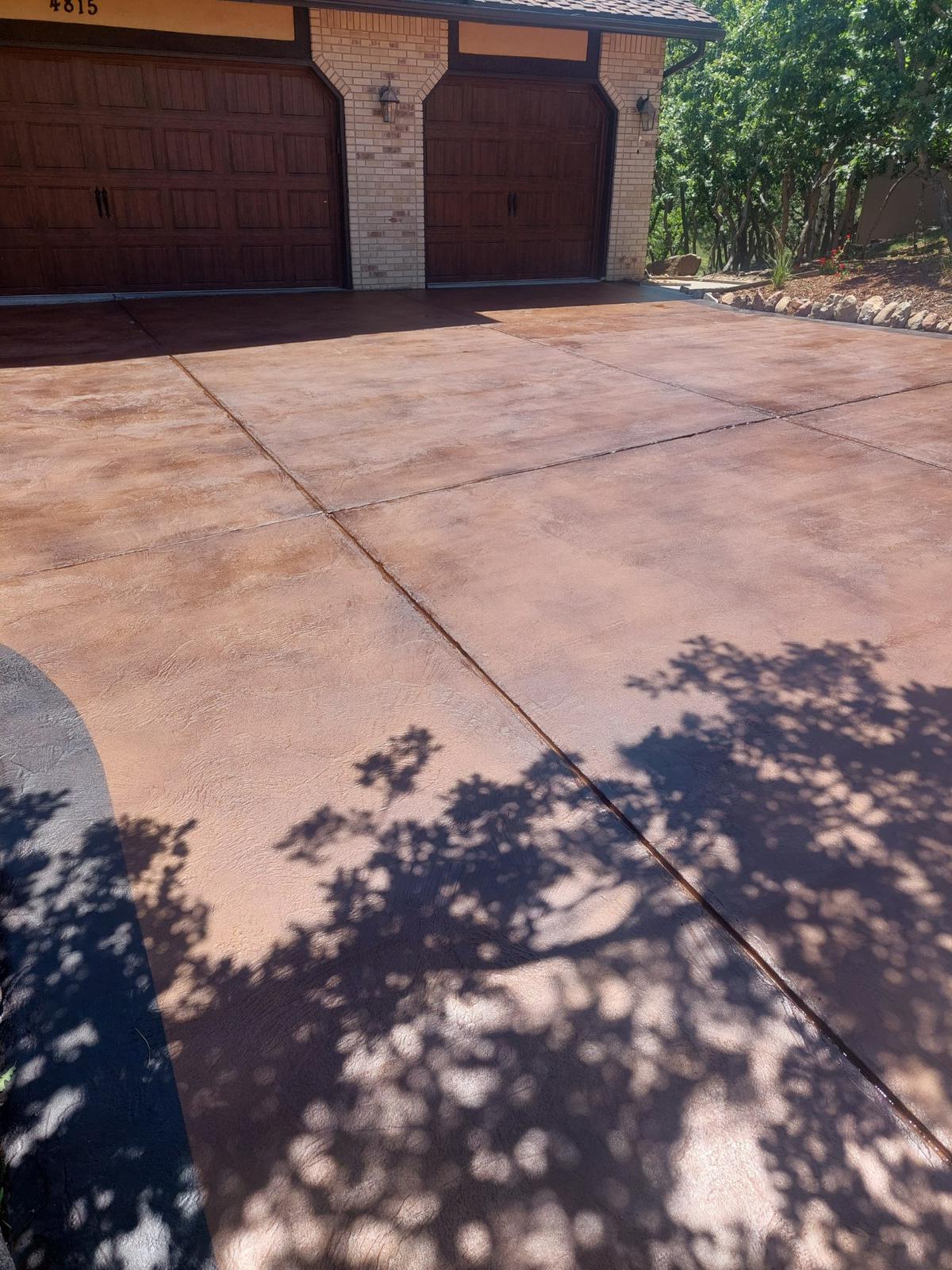 Reddish solid body stained driveway
