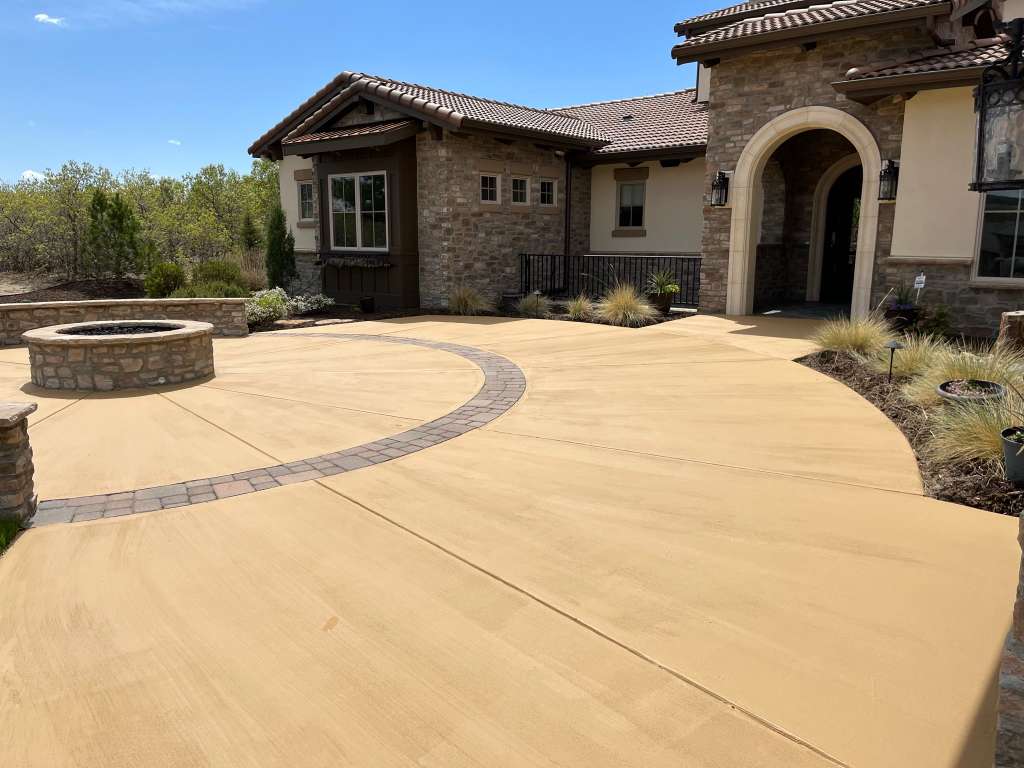 Wide sandstone driveway with paver inlay