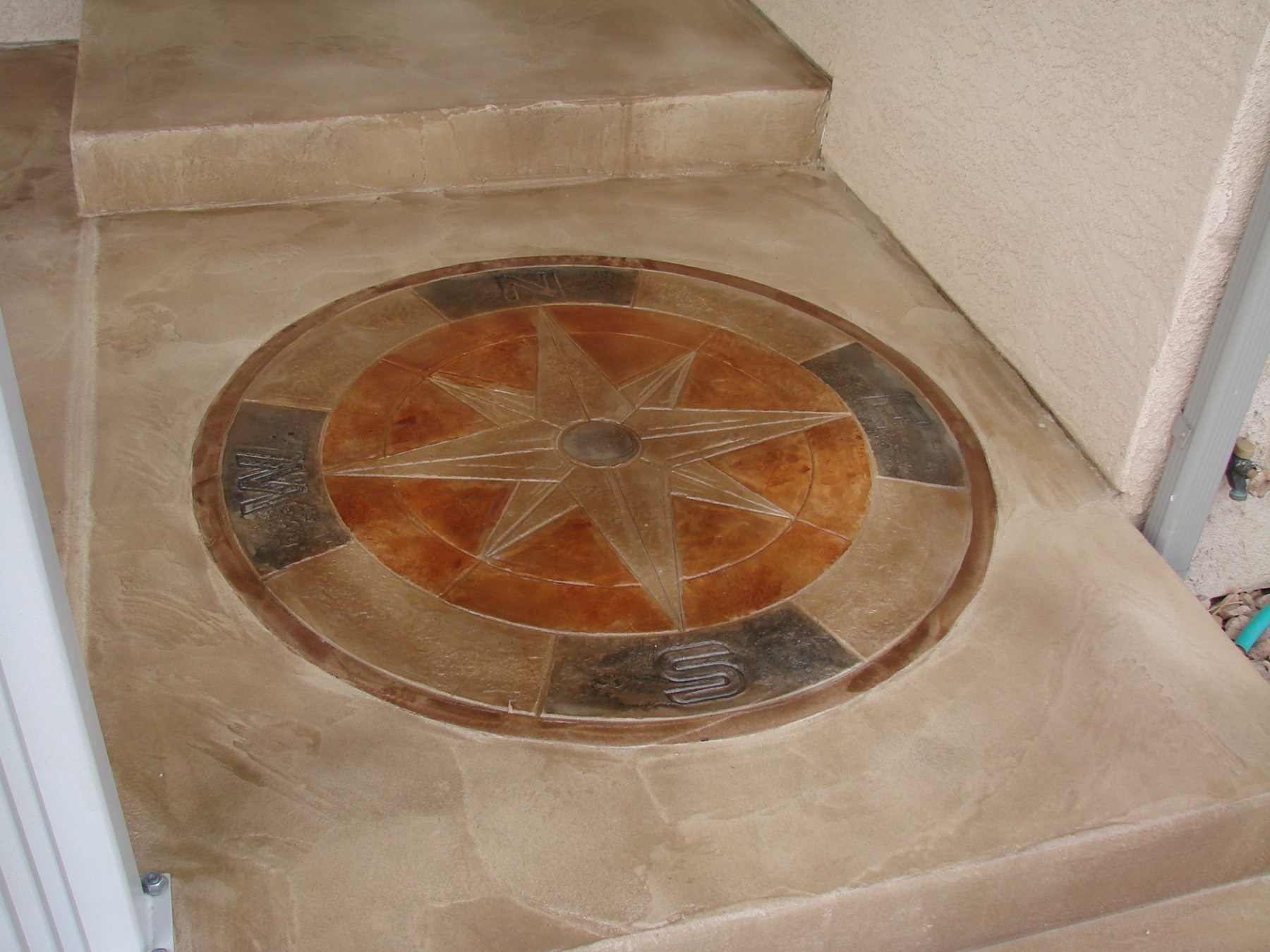Compass stamped concrete overlay